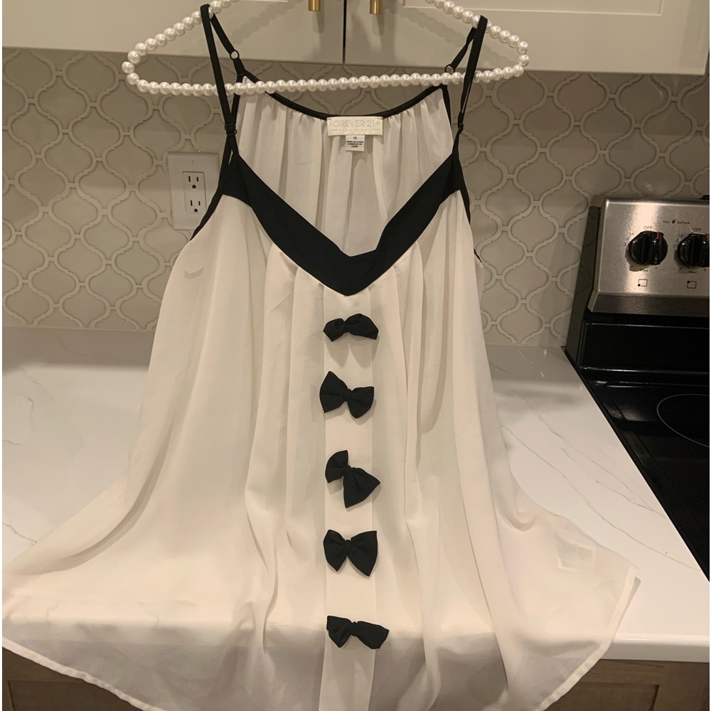 Ivory & Black Sleeveless Blouse with Bows